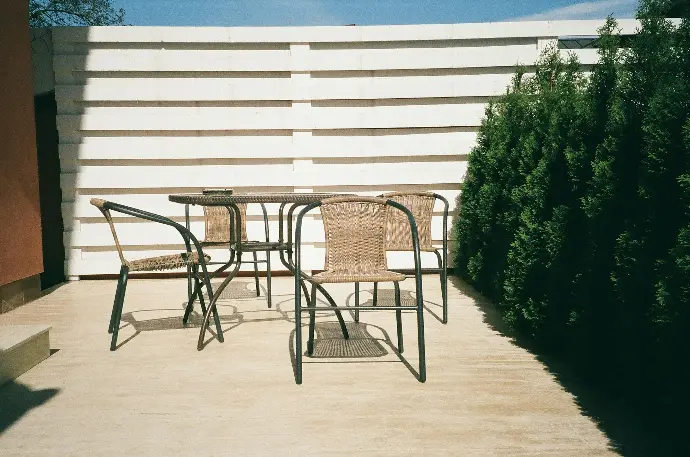 black metal framed white wooden table and chairs